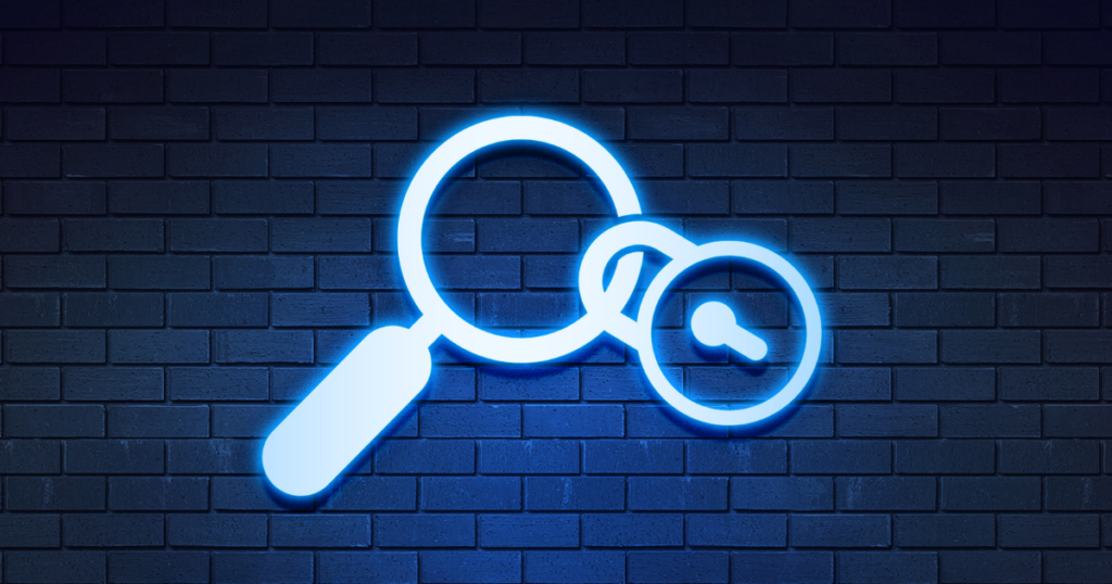 a padlock linked to a magnifying glass against blue tile background