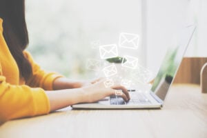 woman typing on laptop